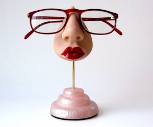 idee regalo originali supporto porta occhiali a forma di viso di donna